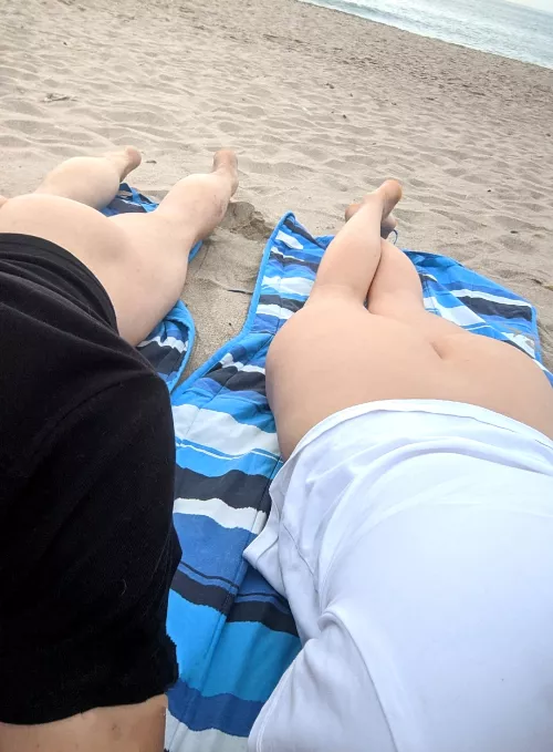 A married couple of exhibitionists on the beach