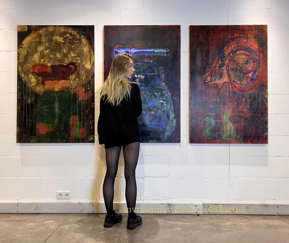 Just in sweater and tights next to my paintings