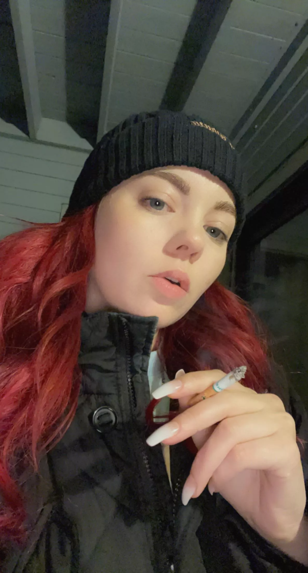 Redhead enjoying a nice smoke on cold winter night