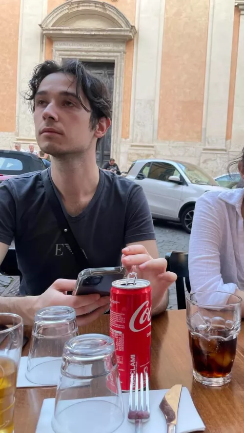 Watching the pizza make its way to my table.