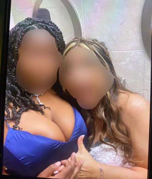 My wife (in blue) and her irresistible cleavage