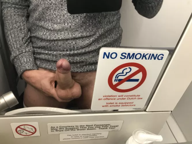 Bored on the plane. It says no smoking not no wanking.