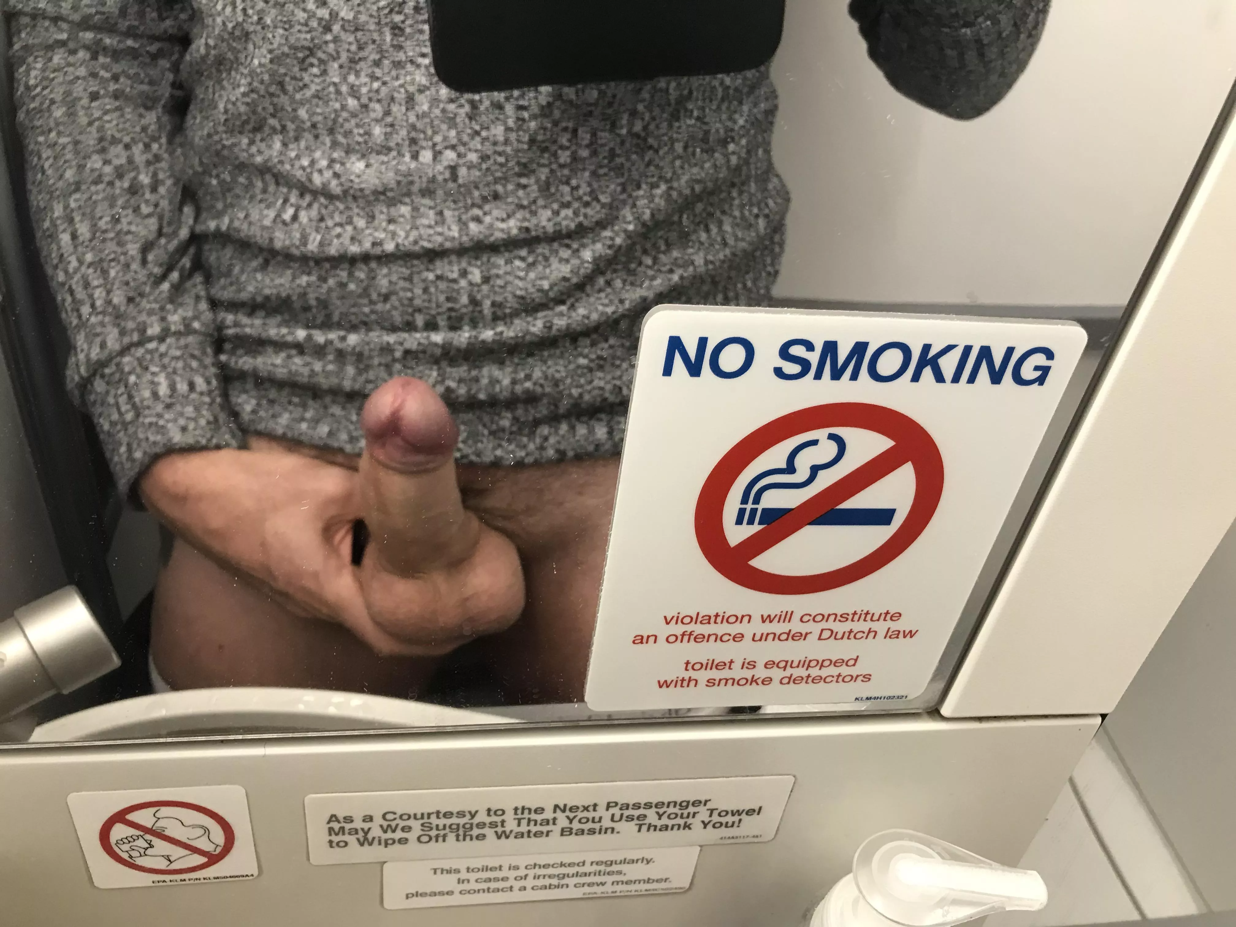 Bored on the plane. It says no smoking not no wanking.