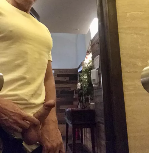 In the restaurant rest room with a colleague. Left the door wide open so that an waiters who came out of the kitchen could see.