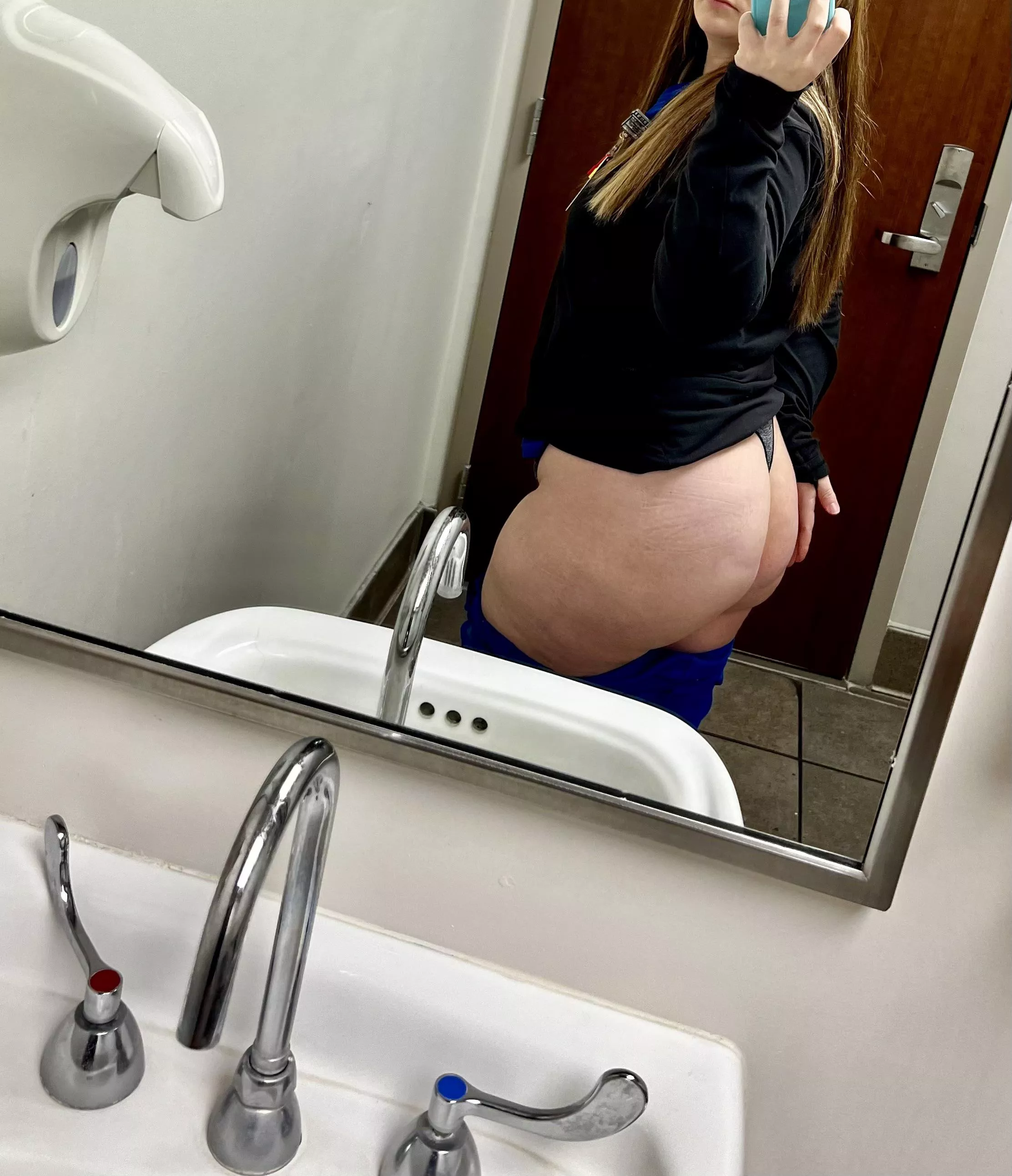 Naughty nurse clocking in for her shift.