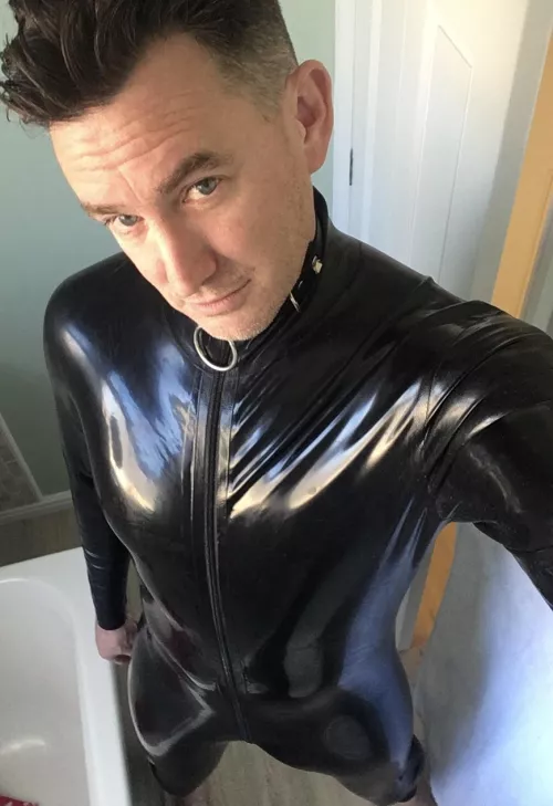 Only thing better than wearing shiny black latex is serving you.