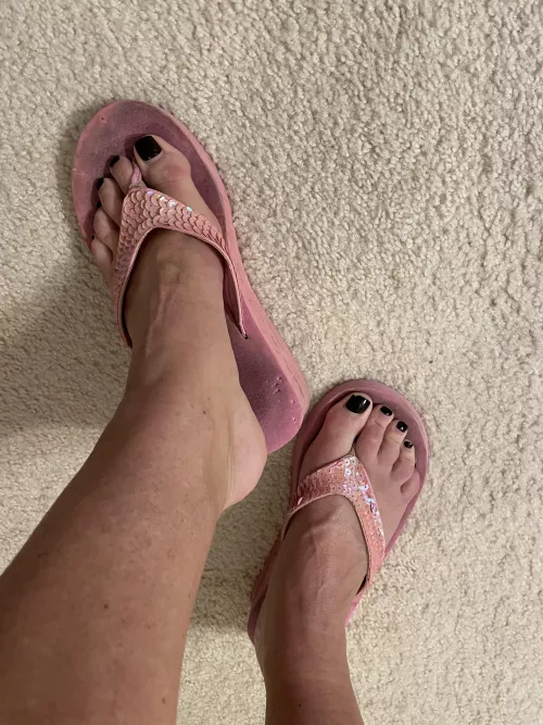 Well Worn Pink Flip Flops. ….