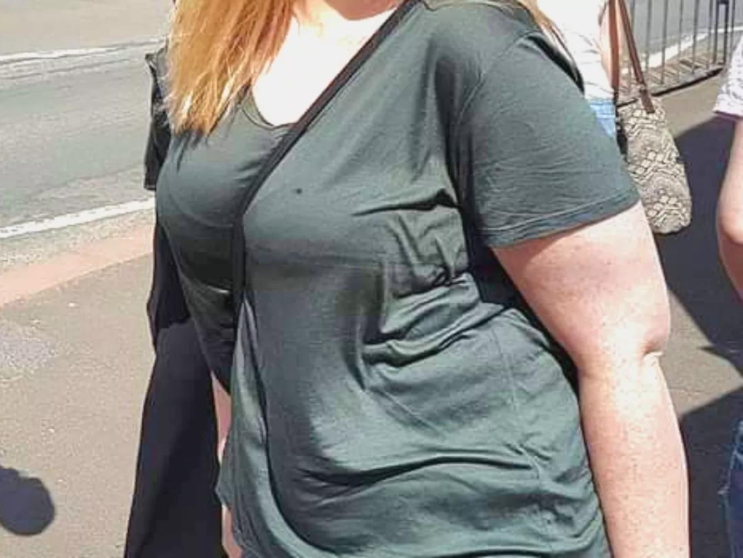 Bra line with bag strap showing how round they are