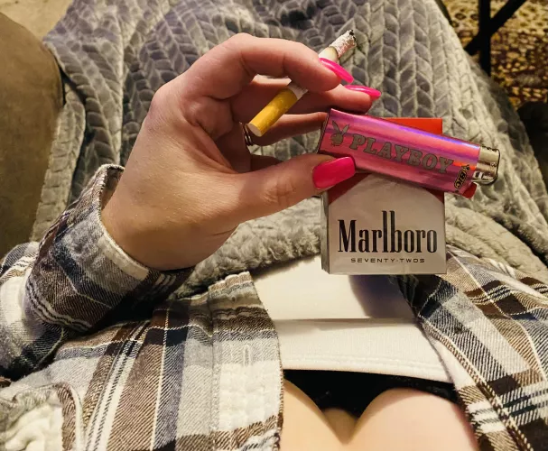 Enjoying a Marlboro Red 72 and my new pink Playboy lighter!