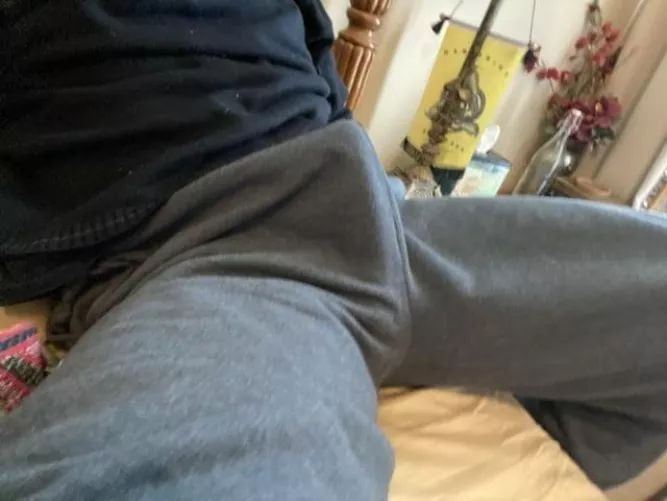 lounging in gray sweatpants