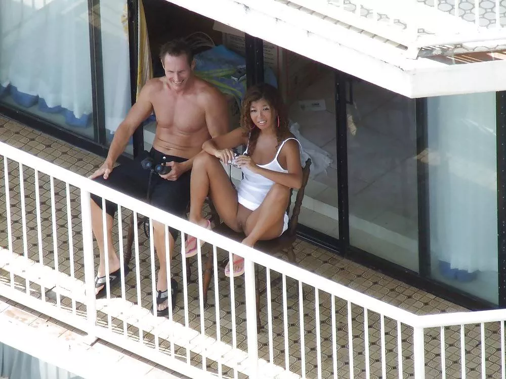 She flashing her neighbours on the balcony