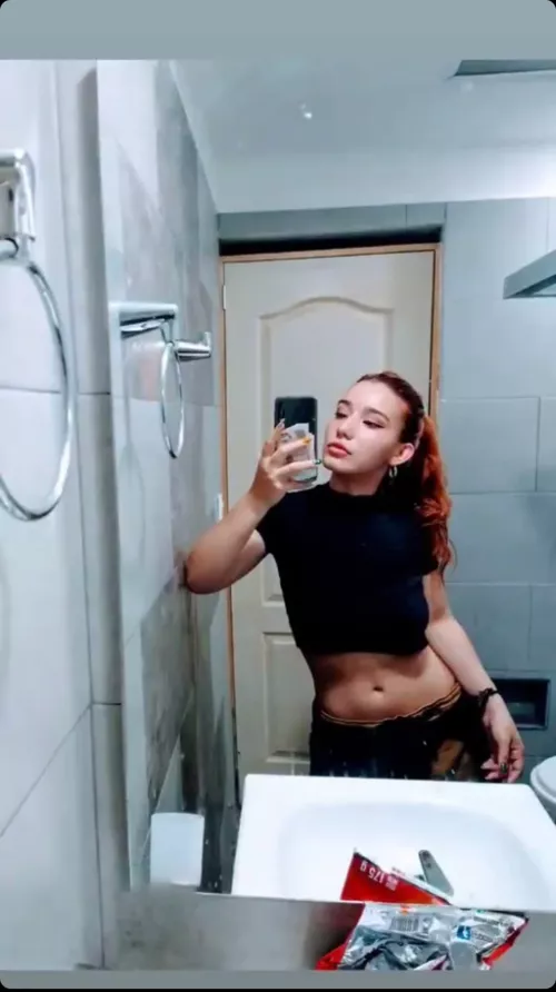 Showing midriff in the mirror