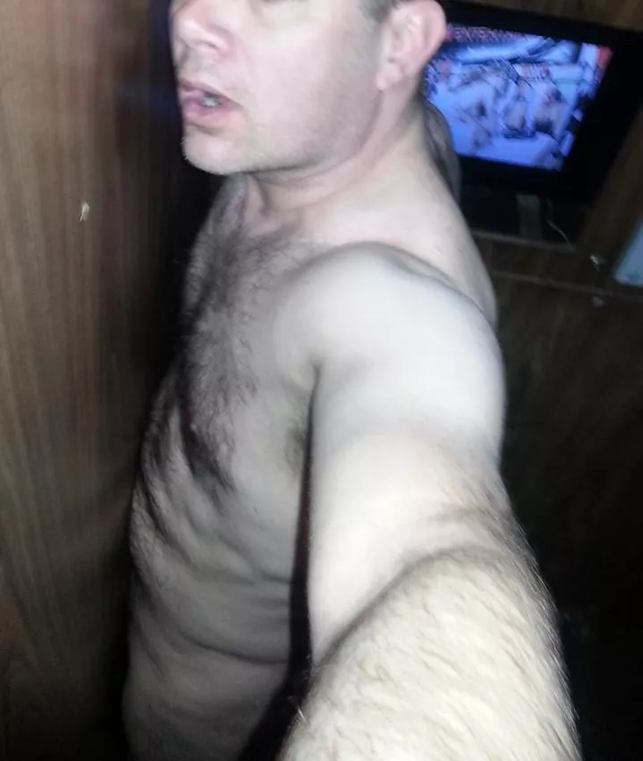 Enjoying the XXX theater glory hole.