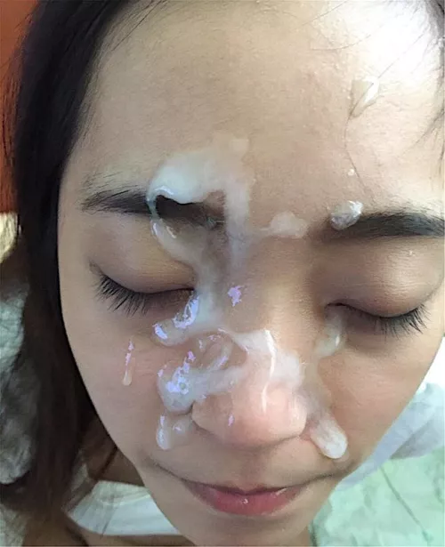 She love the feel of cum on her face
