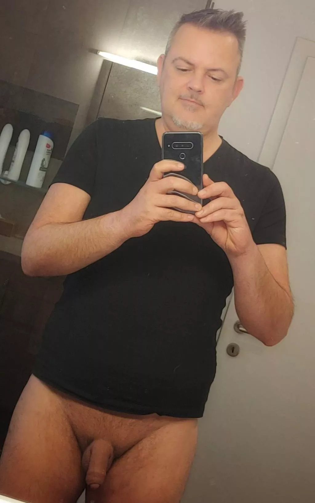 In a good mood in front of the mirror