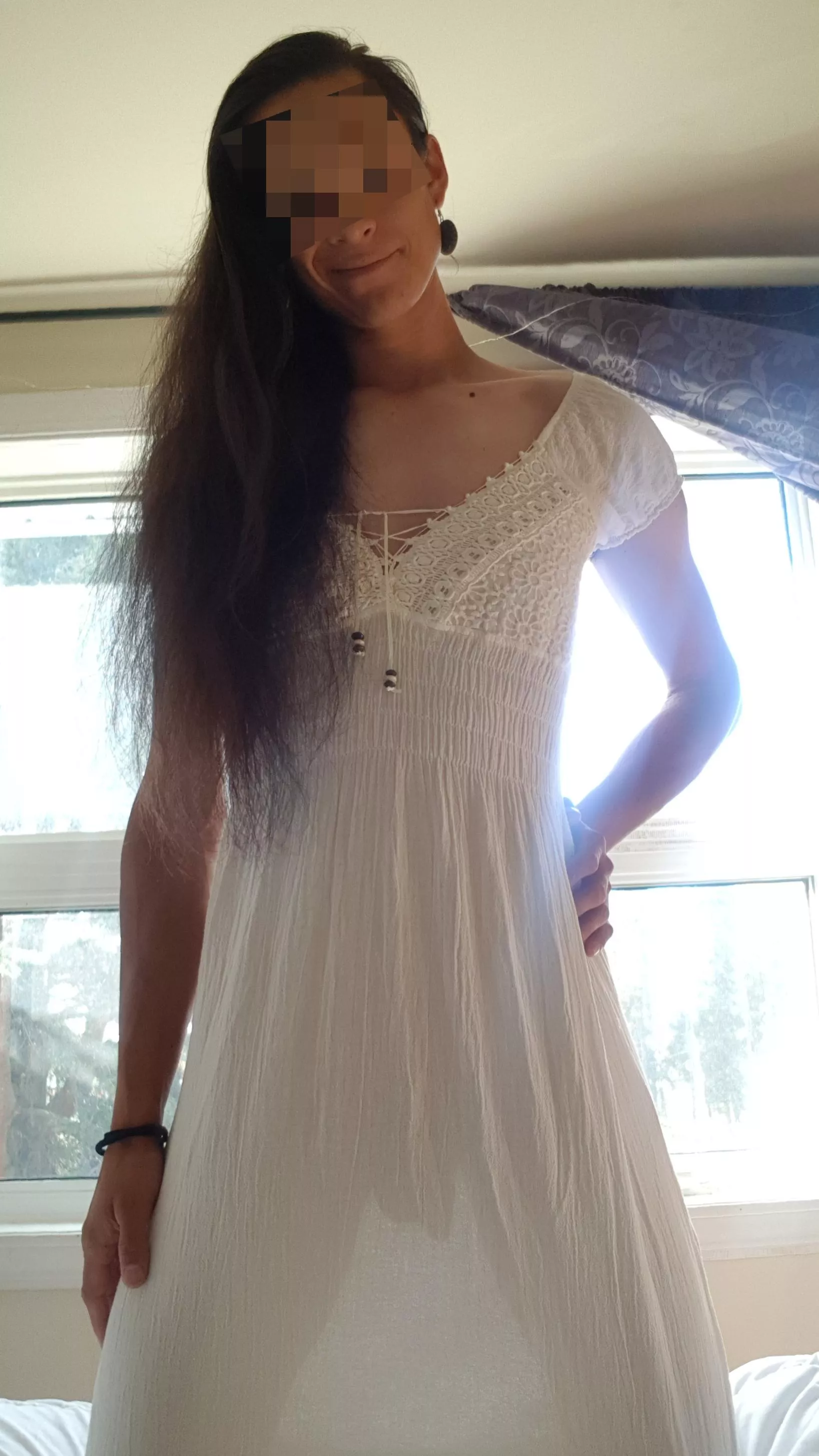 When the sun shines through a dress and makes it translucent. Clothed NSFW.