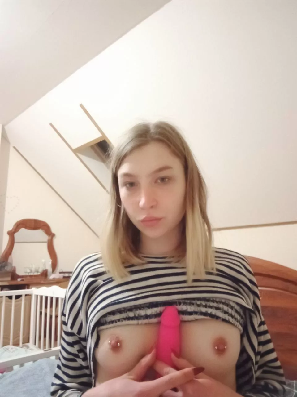 A dildo between my small pierced breasts or maybe a dick in my mouth?