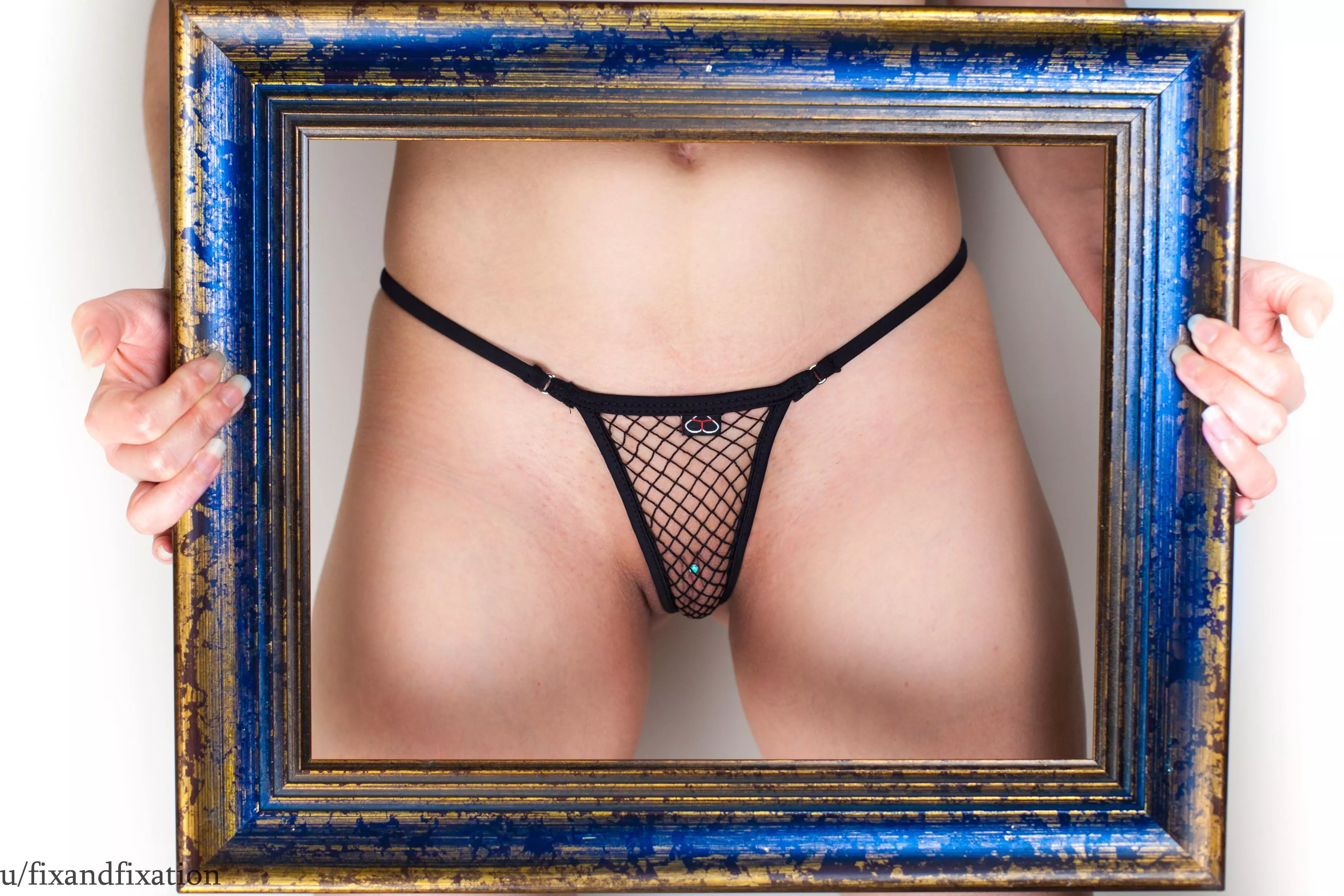 Pierced MILF in a fishnet thong