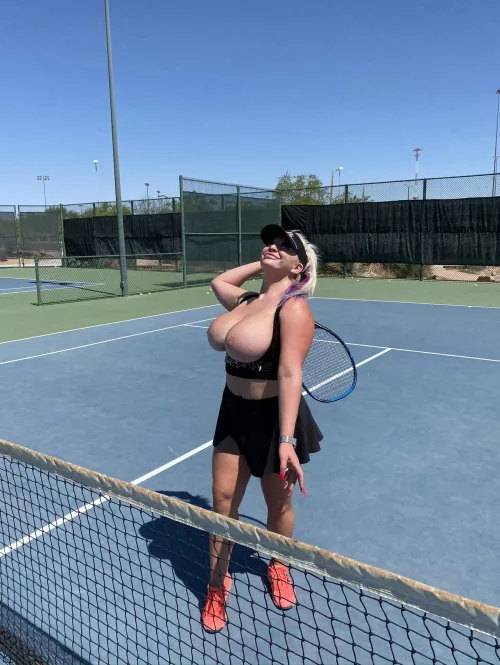 Playing tennis topless
