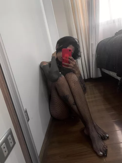 Wearing nothing but fishnets