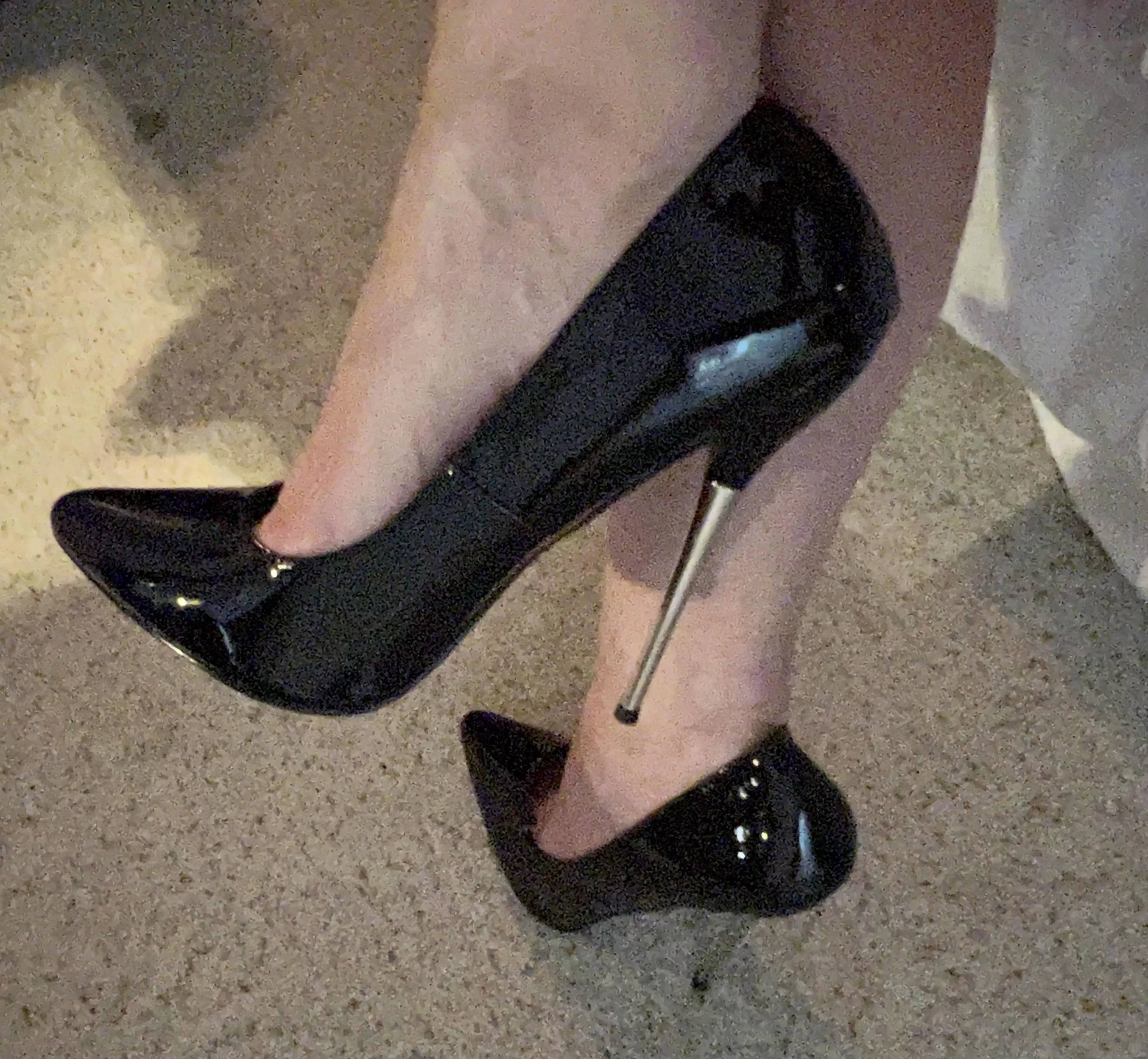 Black stilettos with silver tipped heel