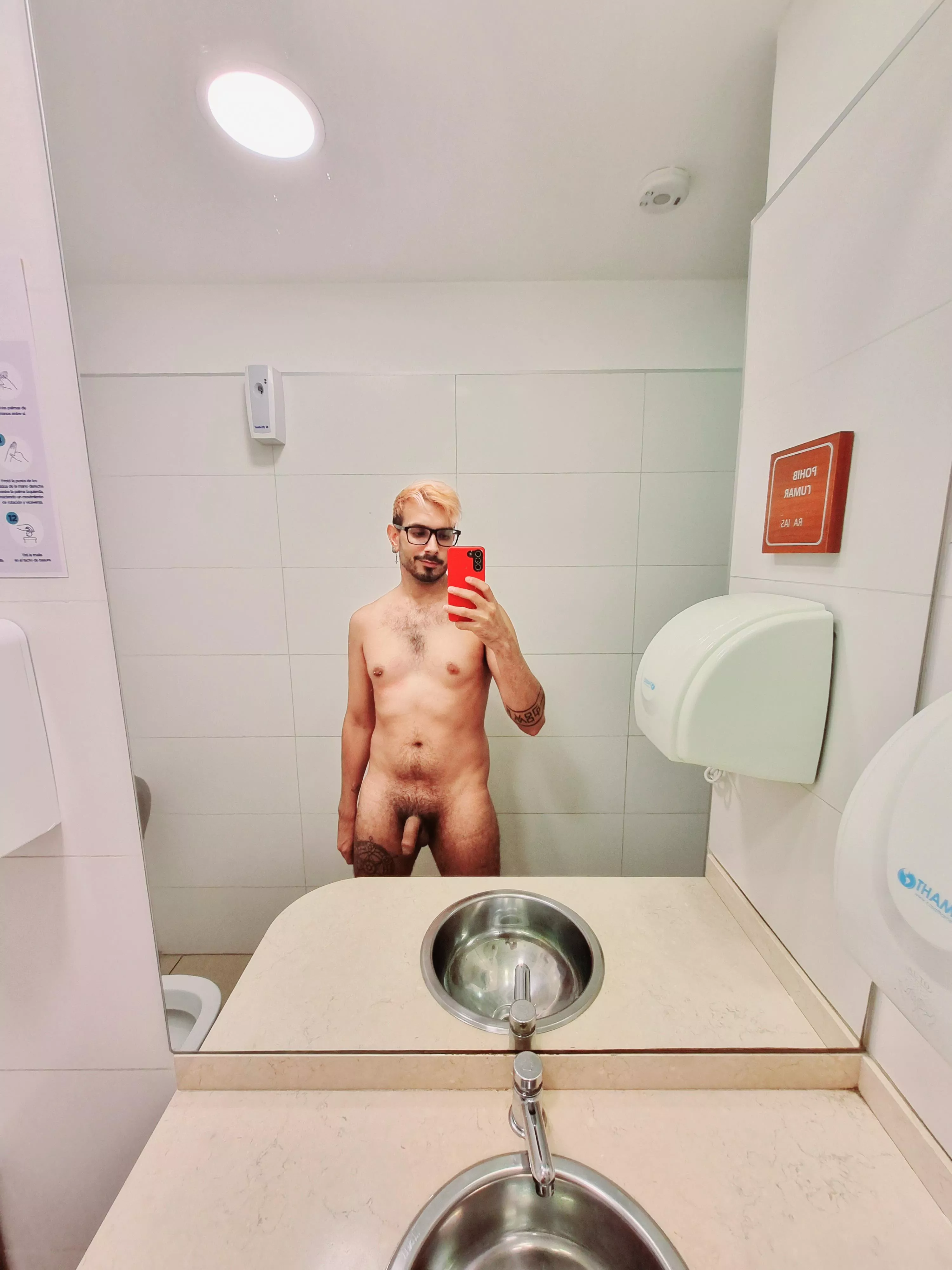 Fully naked in public bathroom