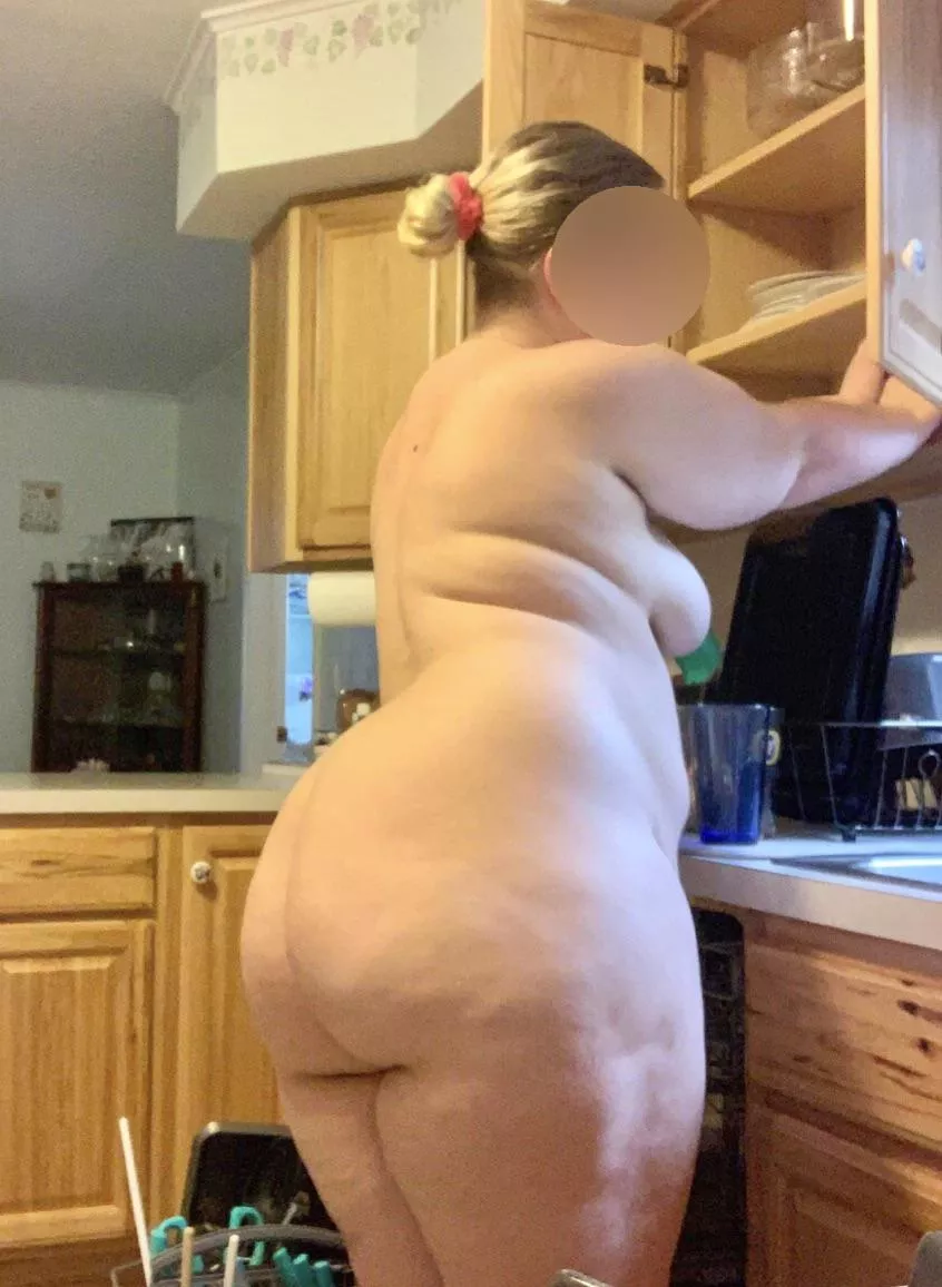 Wife cleaning the kitchen this morning.