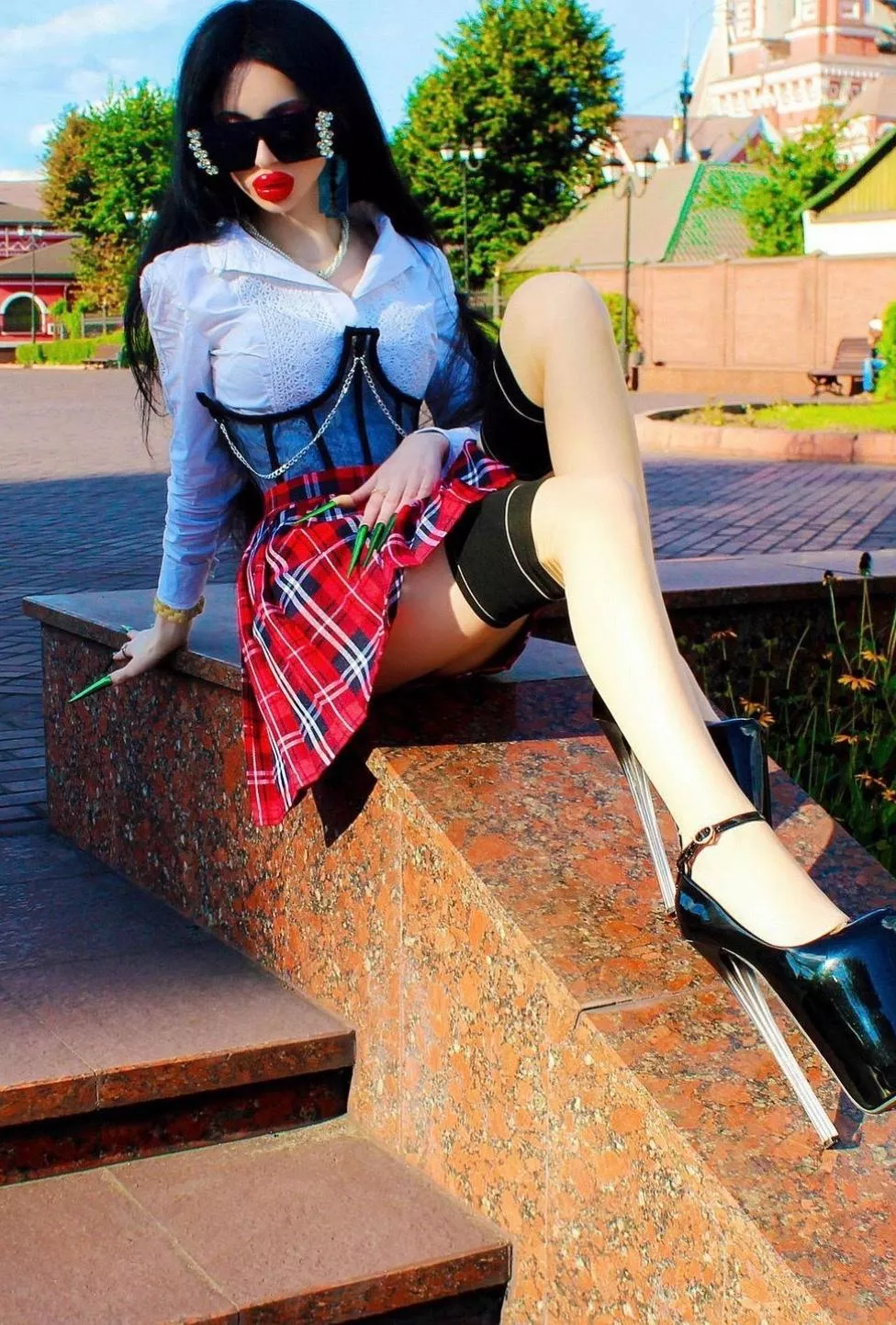 In a red short skirt on the street