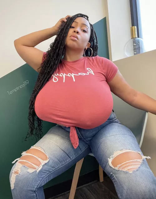 almost sitting on her lap