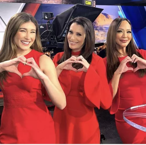 Reporters in Red Dresses