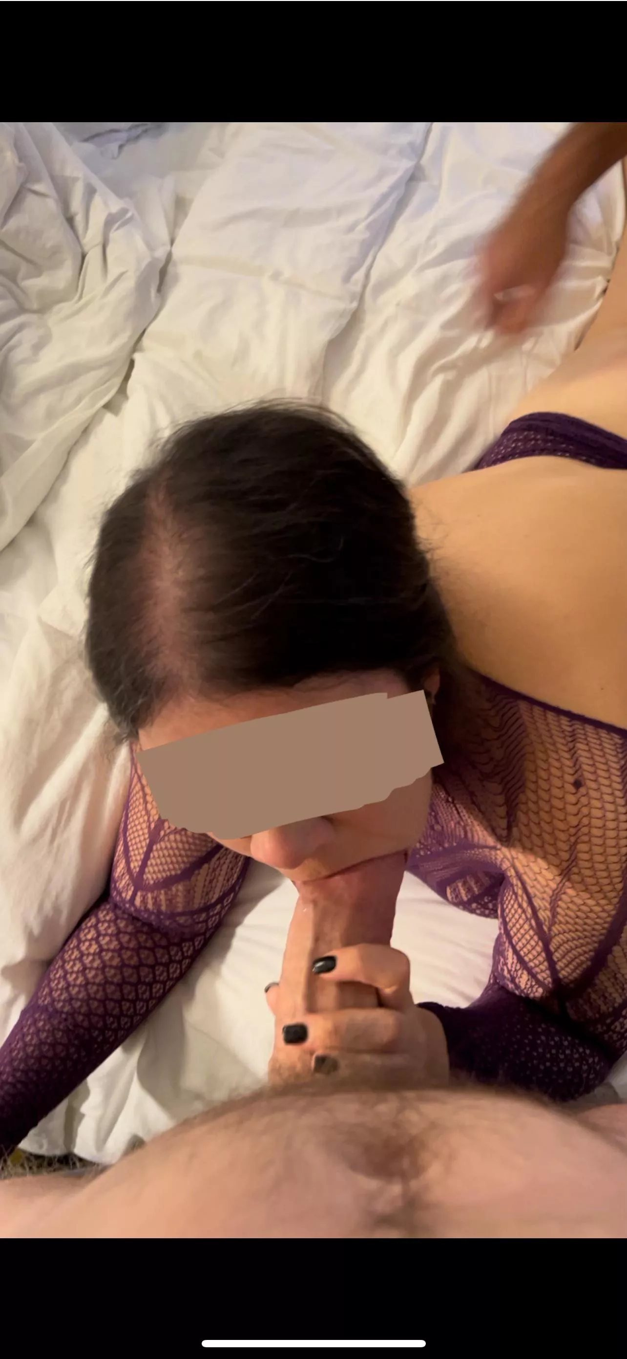 Giving her a mouthful while her husband takes her from behind