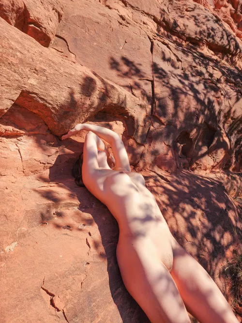 Skin against rock, natural yet molded by force