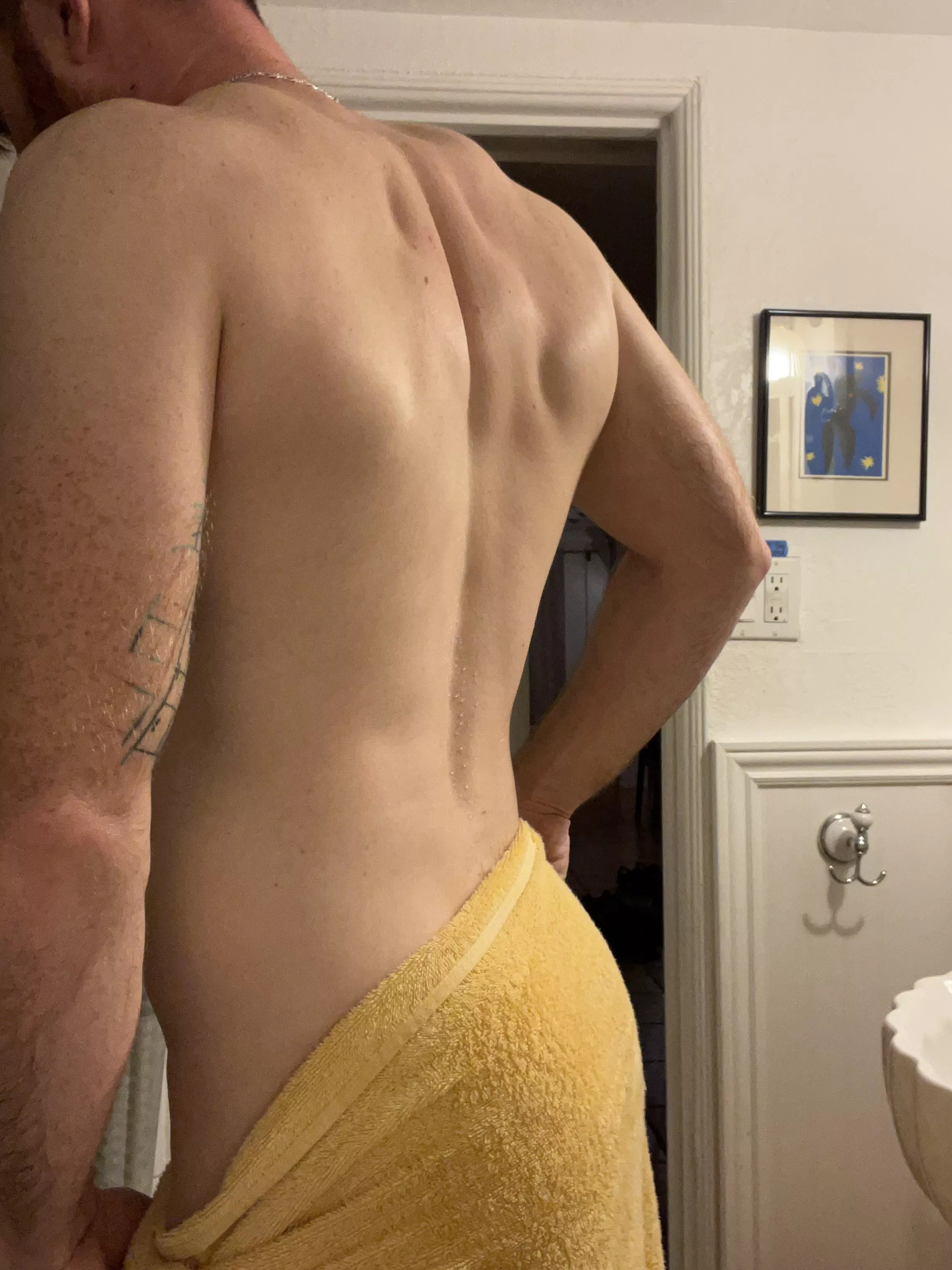 Start at my back, and put your hands on my towel. Kiss my neck, and slowly take it off…