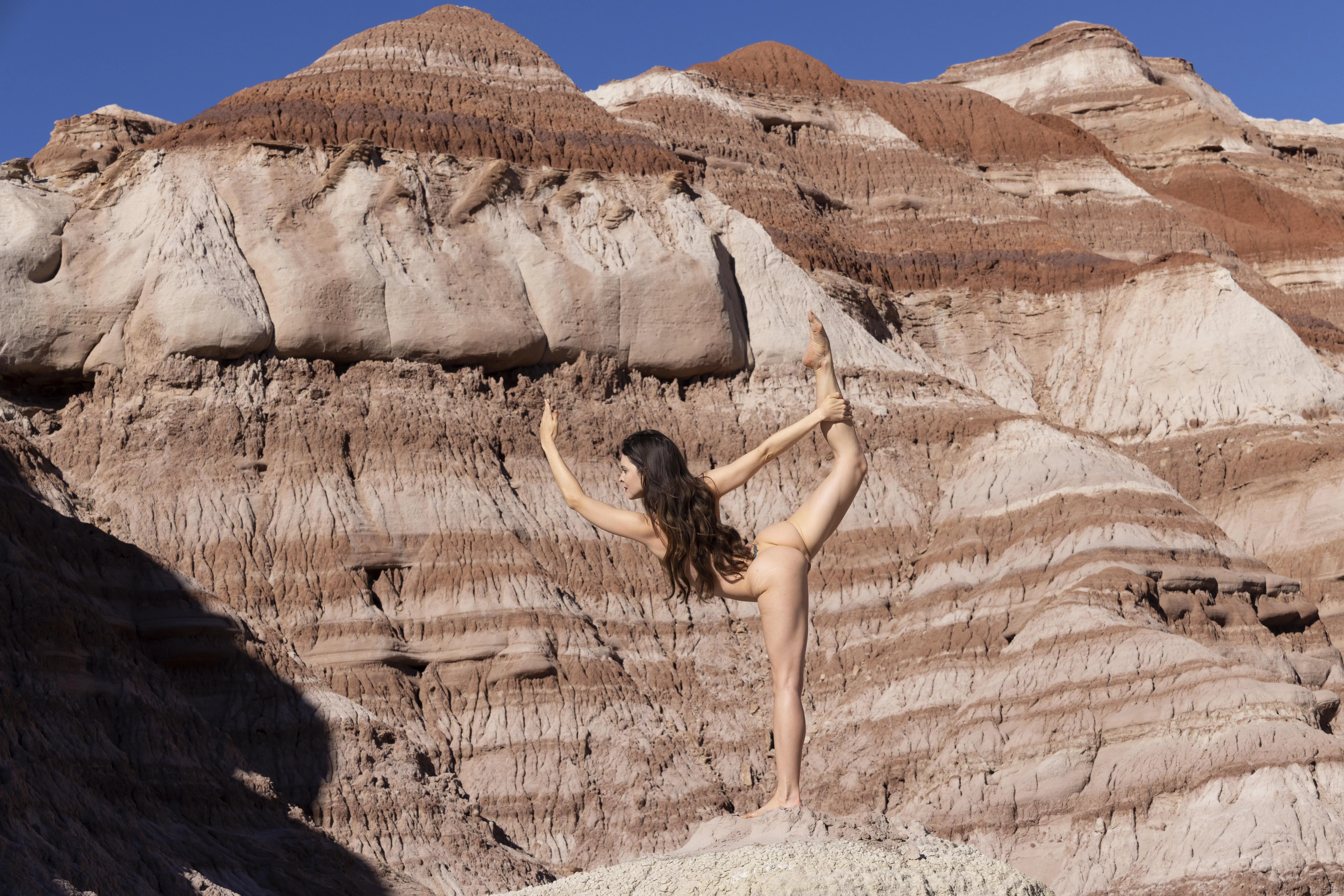 Balancing nude dancer pose