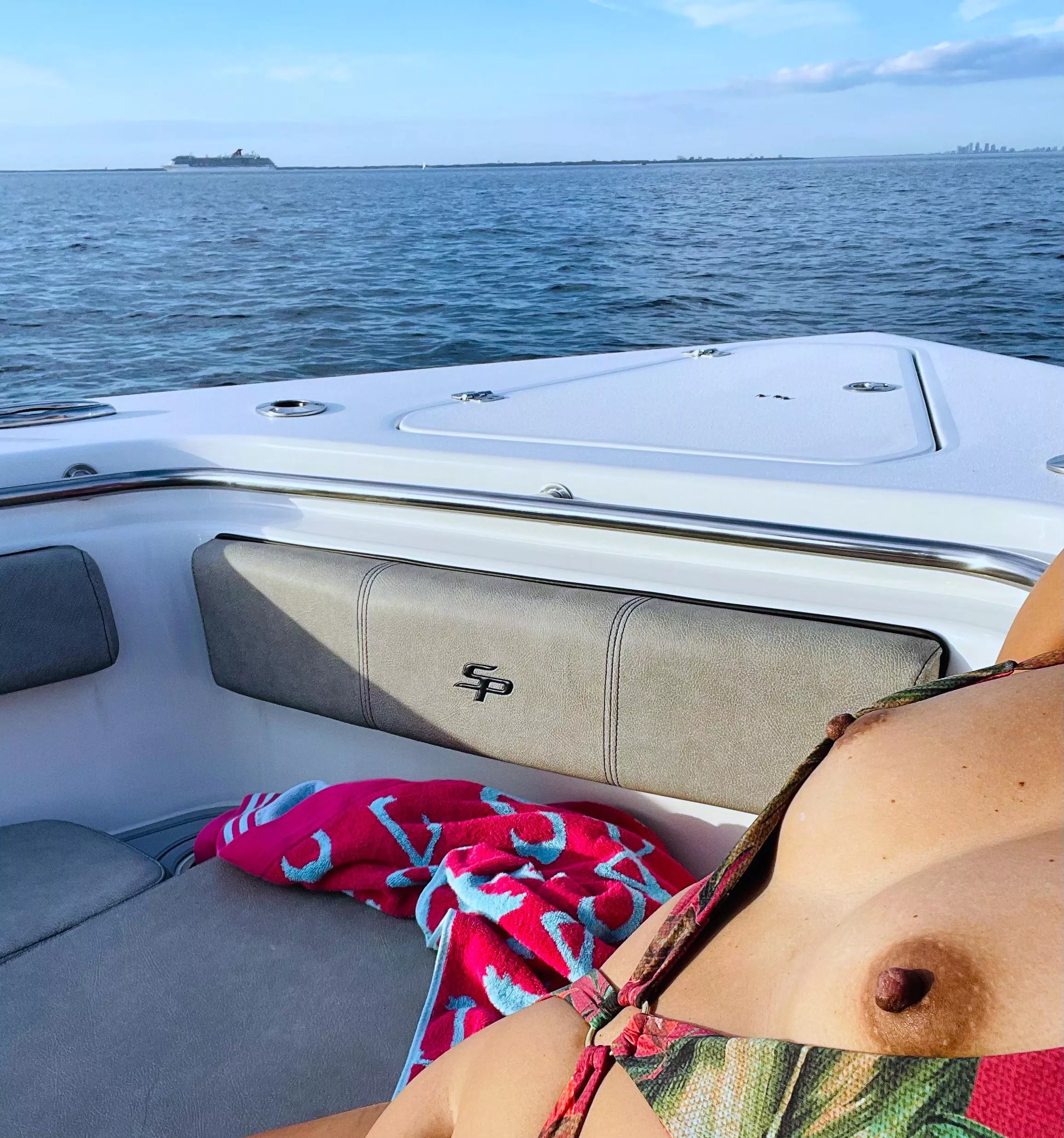 Trying to get a little tan while the cruise ship passes by 🛳️🍒😈