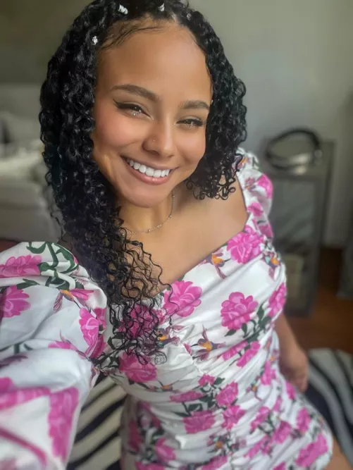 Feeling confident and happy in my new dress, smiling from ear to ear