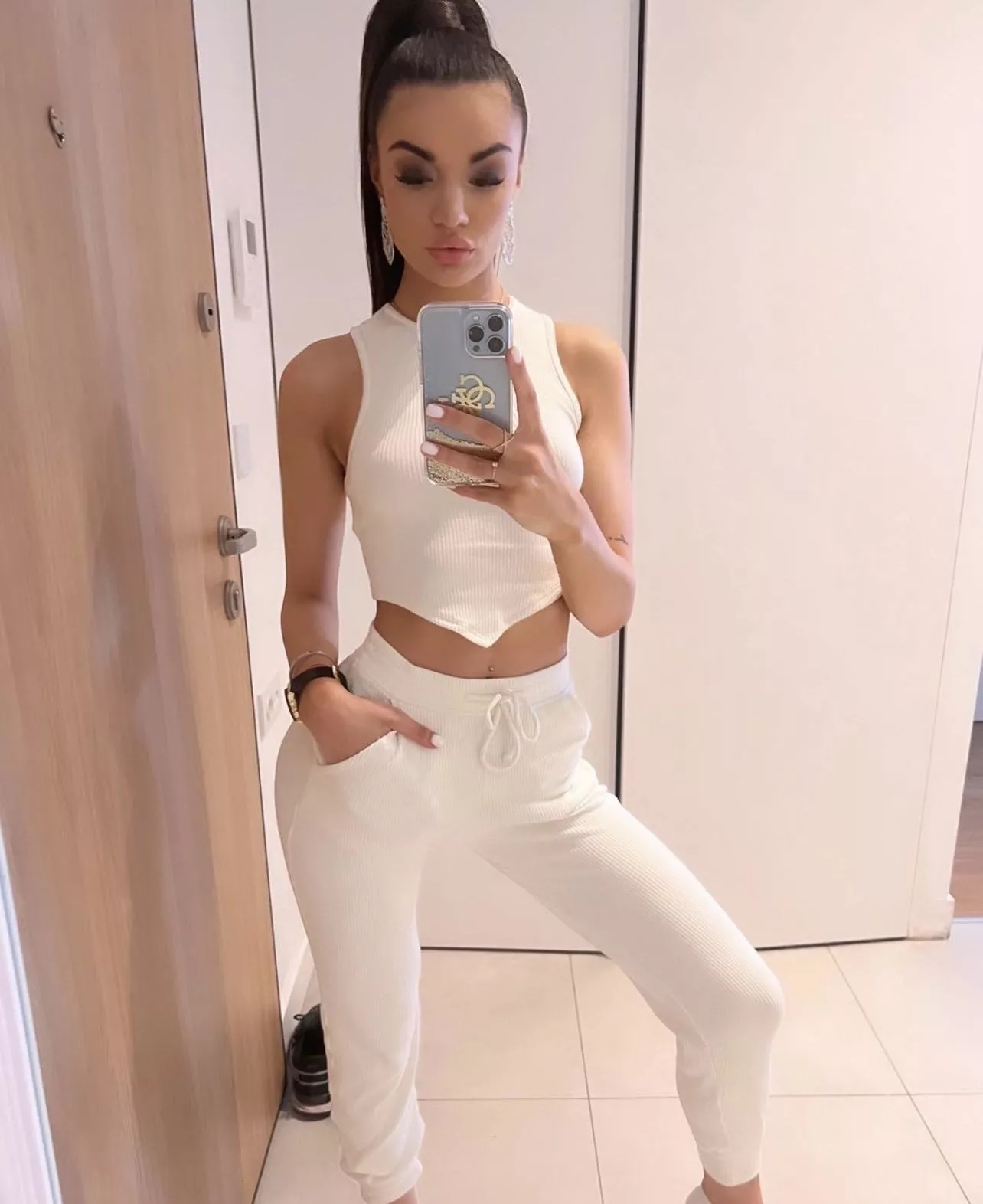 Lady in all white, seeing through the curves !