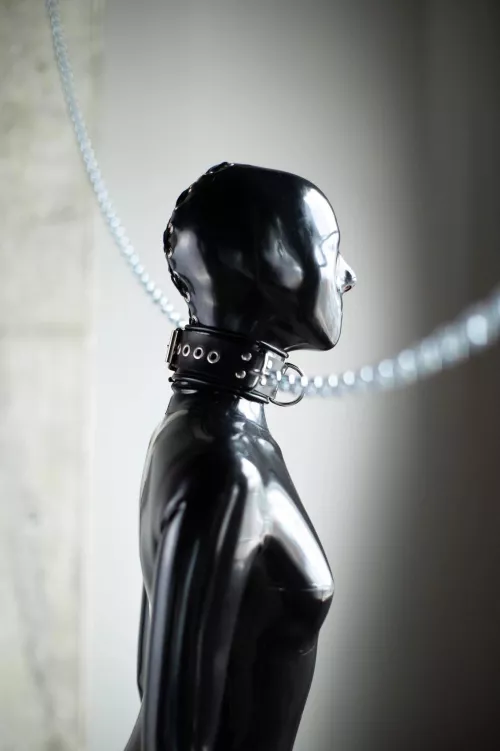 Sub in latex bondage and leash