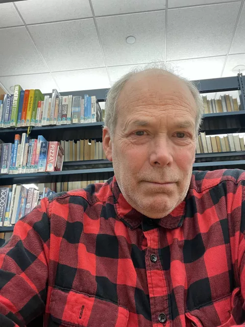 Here I am in front of a shelf of travel books.
