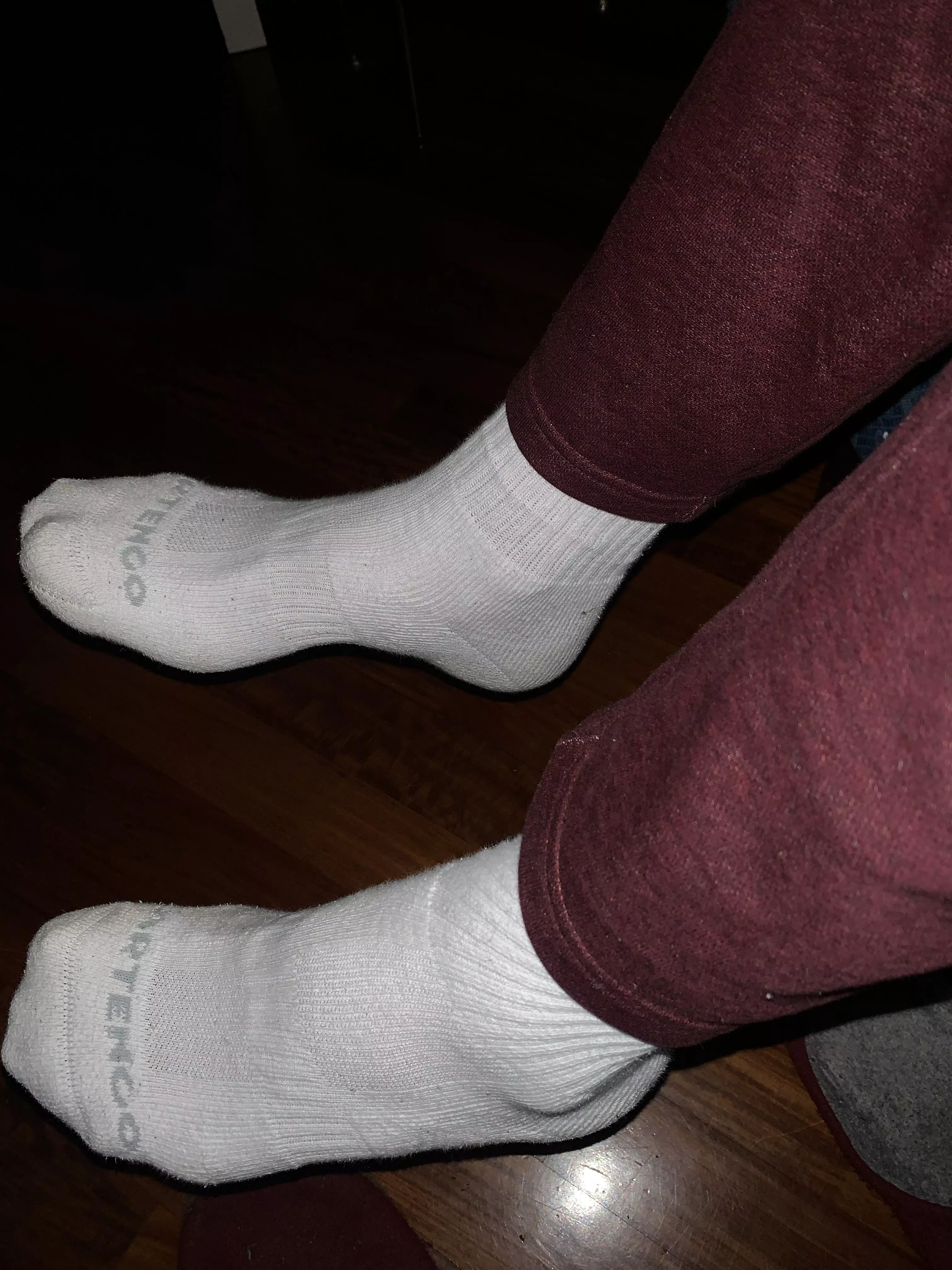 Big feet in white socks