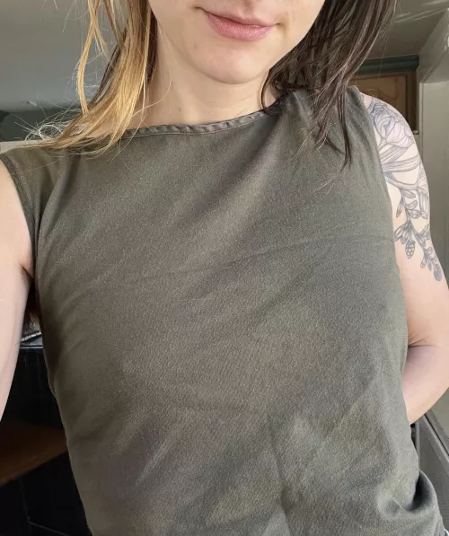 No bra under my green tank top
