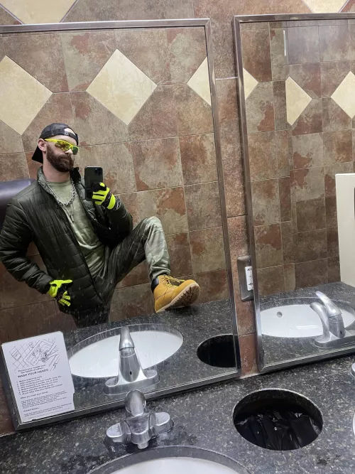 Hi Viz with boots, public, and puffy coat. (And 2 ball stretchers and a cock ring underneath)