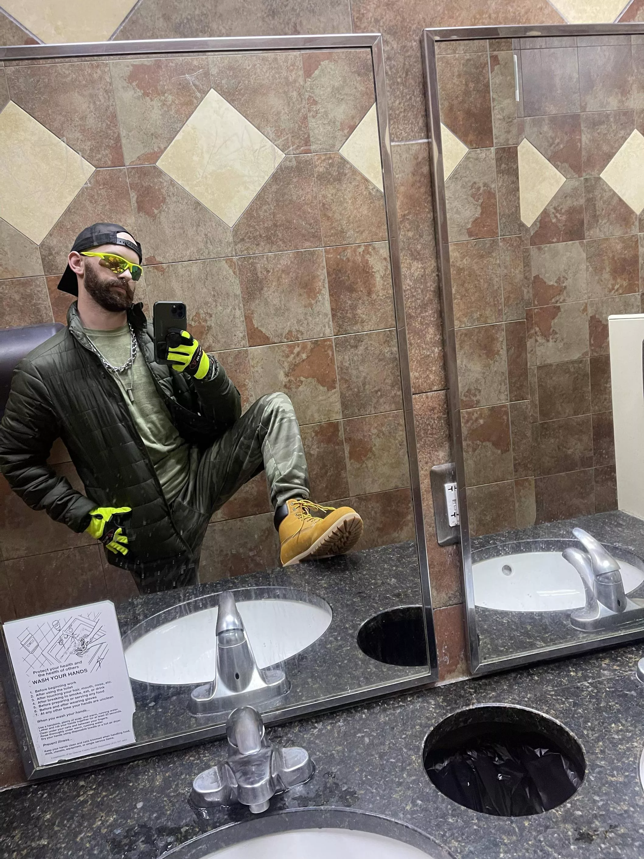 Hi Viz with boots, public, and puffy coat. (And 2 ball stretchers and a cock ring underneath)