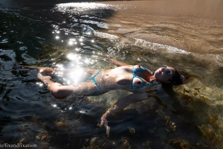 My wife u/fixandfixation floating in paradise wearing a barely there bikini
