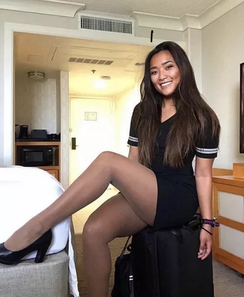 No, her skirt is not short, her legs are long