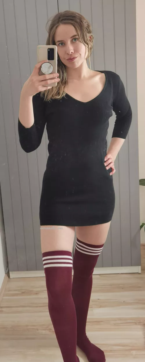 Black dress with red thigh highs. How do I look?