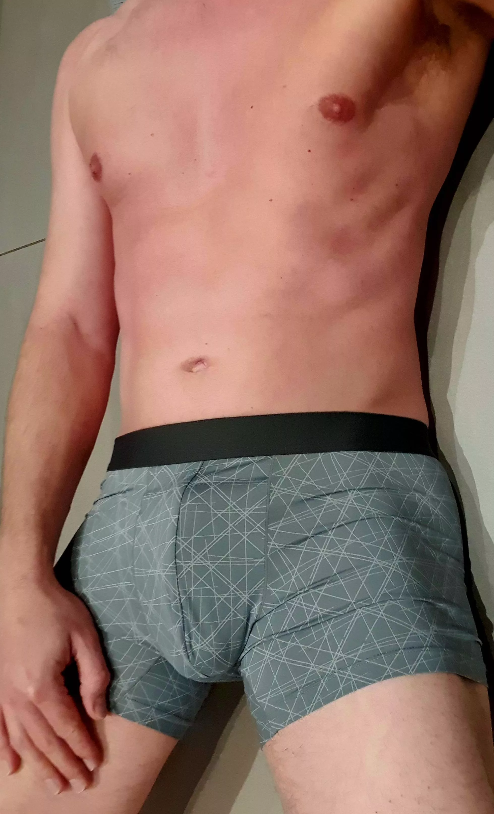 Doing morning stretches in boxer briefs