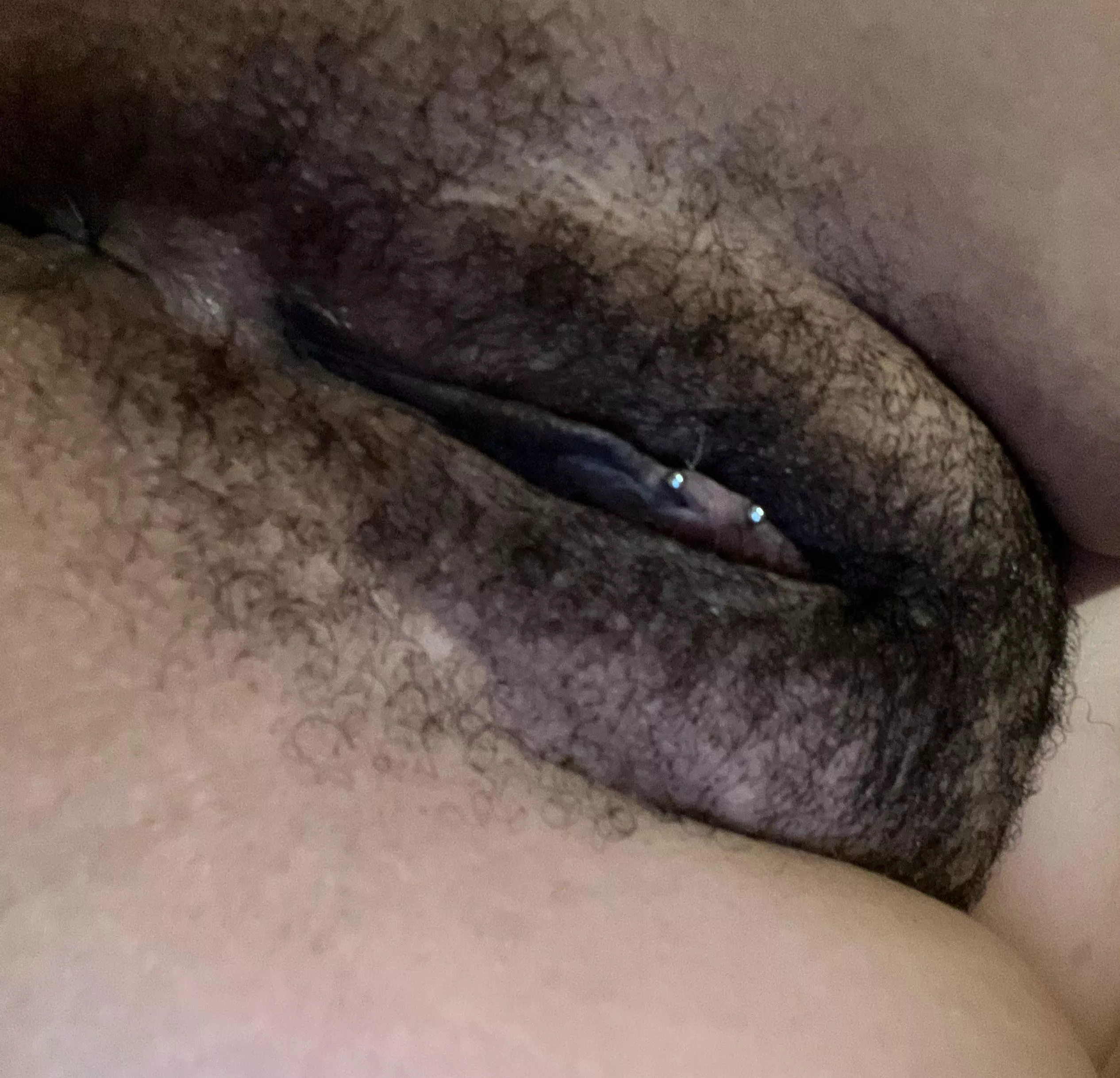 Pierced hairy pussy