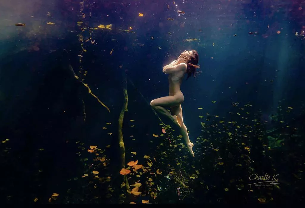 Floating naked amongst lily pads (by @Kruzphoto)