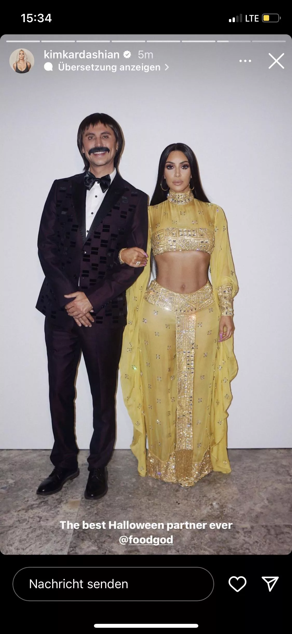 Kim with sixpack abs on Halloween